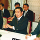 Prime Minister Hashimoto (center) holds an emergency meeting to discuss giant-monster containment strategies.